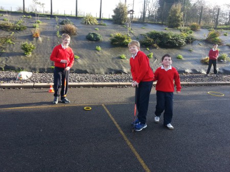 Adam, Niall and Liam getting creative with hockey sticks and hoops.